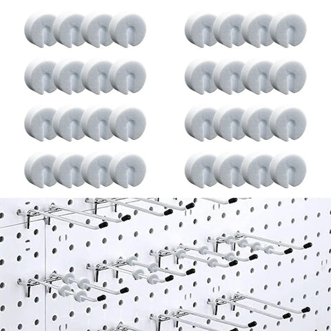 100 Pack Peg Hook Stoppers For Pegboard Slatwall And Gridwall Displays White Foam Peg Locks on hooks in a grid pattern