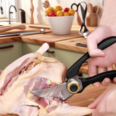 Heavy Duty Kitchen Scissors With Non Slip Handle And Auto Unlock For Cutting Meat Poultry Roasts Turkey And Fish Serrated Stainless Steel Blades With Ergonomic Grip Tough Yet Easy To Use Everyday Kitchen Tool cutting raw chicken on wooden counter