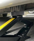 Dual Use Lifting Axle Saddle Adapter Pads, 2 Pack For BMW X3 X5 X6 X7 And Mini, installed on hydraulic jack lifting vehicle