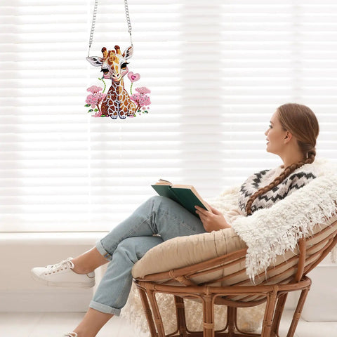 Diamond Painting Hanging Pendant Kit For Adults with giraffe design next to woman reading by window.