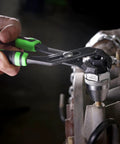 Durable Universal Stud Extractor For Damaged Bolts And Broken Studs, Fits 1/4 To 1/2 Inch Studs, Works On Rusted Bolts And Worn Screws, Manifold Stud Remover, Easy Turn, OEMTOOLS 25438 being used with pliers on engine part.