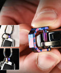 Close-up of Premium Alloy Miniature Keychain Clip With Detachable Screwdriver Tool, colorful design, attached to a keyring.