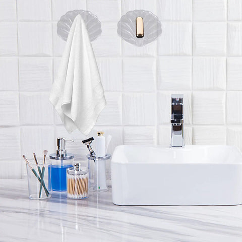 Six Pack Peel And Stick Wall Hooks With Rock Solid Hold For Zero Hassle Bathroom Setup Self Adhesive Hangers For Towels Hats Coats And Everyday Carry holding a white towel in a modern bathroom setting.