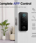 Keyless Entry Smart Door Lock With Fingerprint Anti Peep Code Bluetooth Auto Lock For Front Door iOS And Android App Control No Fuss Install Black Finish For Modern Homes on a wooden door next to a plant and sofa in a living room.
