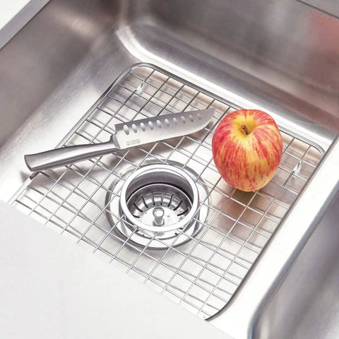 Stainless Steel Sink Grid With Center Drain Polished Finish For Kitchen Use Tough As Nails Heavy Duty Protective Rack That Prevents Scratches Doubles As A Draining Tray And Drying Rack Fits Most Standard Sinks with knife and apple on grid
