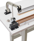 Heavy Hitter 22 Inch Foot Pedal Heat Sealer Machine 850 Watt Bag Impulse Sealer close-up of sealing mechanism on workbench.