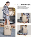 Apricot quilted rolling backpack with wheels; beige laptop bag, front view with extended pull handle.