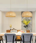 Roomy Bamboo Plug In Pendant Light With Dimmable Switch And 14 Foot Handmade Woven Cord above dining table, featuring natural bamboo design.