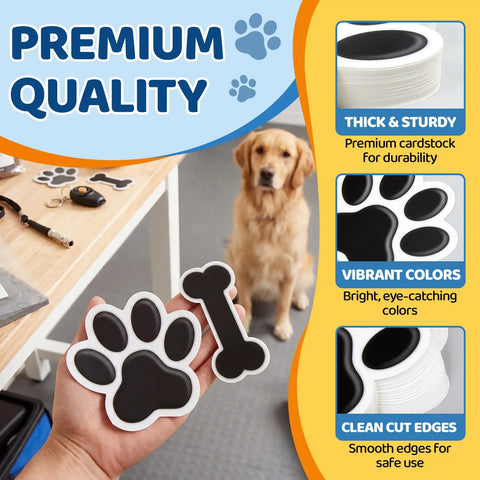 Person holding Black Paw Print And Bone Cutouts Set For Doggy Themed Parties And Classroom Decor 72 Pieces featuring 48 paw shapes