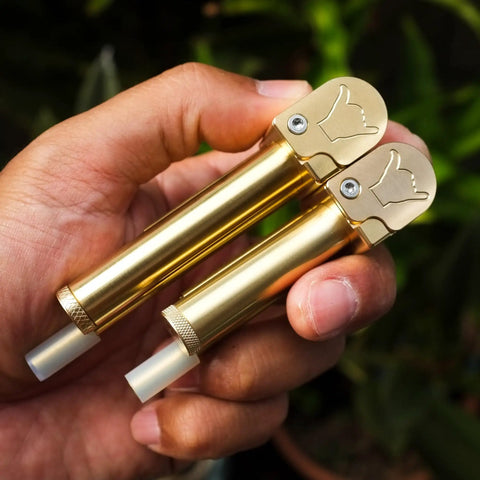 Person holding Durable Brass Portable Tar Trap With Longer Stem And Mega Storage Pod Easy Open Closeable Lid Rugged Pro Grade Style