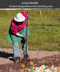 Gardener using Heavy Duty Metal Garden Rake With 17 Prongs And Long Handle For Loosening Soil Leveling Lawns in flower bed
