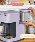 Total Game Changer Multi Brew Coffee Maker 12 Cup Glass Carafe Plus Single Serve Brewer For Pods Or Grounds Brews Over Ice No Fuss Touchscreen Dope Lavender Finish with removable 40oz water tank.