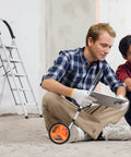 Two men sitting on floor with Distance Measuring Wheel With 20 Flag Markers, 40 Inch Reach, 4 Inch Wheel.