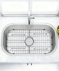 Heavy Duty Foldable Sink Protector Grid With Center Drain And Rounded Corners No Fuss Stainless Steel Drop In Sink Bottom Rack in shiny kitchen sink.
