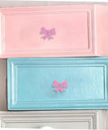 Super Dope Pink Bow Cabinet Pulls Pack Eight Piece Alloy Dresser Knobs For Girls Bedroom Refresh Easy Mount Cabinet Hardware on pink and blue drawers.