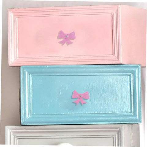 Super Dope Pink Bow Cabinet Pulls Pack Eight Piece Alloy Dresser Knobs For Girls Bedroom Refresh Easy Mount Cabinet Hardware on pink and blue drawers.