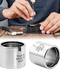 Person using Stainless Steel Watch Movement Holder With Fixed Jaw Non Adjustable Base, showing close-up of cylindrical holder.