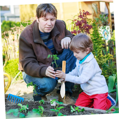 Child using Ergonomic Hand Shovel for Gardening, No-Fuss Grip, Dig Deep Spade for Planting with adult in a garden bed