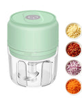 Chill Out With This Tiny Wireless Garlic Chopper That Zips Mini Food Processing. Compact green electric mincer with diced veggies.