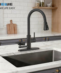 Kitchen Faucet with Glass Rinser, Pull Down Sprayer, 3 Water Modes in sleek black finish on marble countertop.