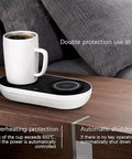 Slick Coffee Mug Warmer And Drink Cooler With Quick Wireless Charger 3 In 1 Electric Cup on a wooden table with a white mug.