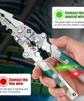 Person using 18 In 1 Foldable Wire Stripper With Voltage Detector, indicating live and neutral wire contact, on electrical panel.
