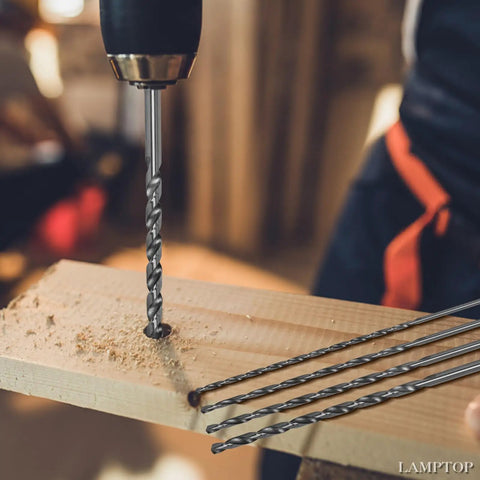 Topshelf 39 Piece Countersink Drill Bit And Wood Plug Cutter Set With Deburring Tool Step Bits And High Speed Steel Hex Shank Multipurpose Drill Kit drilling into wood with a twist drill bit.