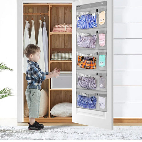 Child using Weekly Kids Closet Organizer Hanging Wardrobe Organizer Monday Through Friday with Clear PVC Pockets, Grey fabric.