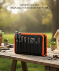 Vertical Tool Organizer Bag For Workbench Red Oxford Cloth Caddy displayed on outdoor table with tools and plants.