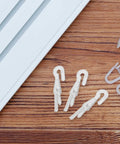 Rock Solid 12 Piece Blind Wand Replacement Hooks Built With Heavy Duty Alloy For Smooth Tilt Action And Fast Window Treatment Repairs Around Your Place on a wooden surface.
