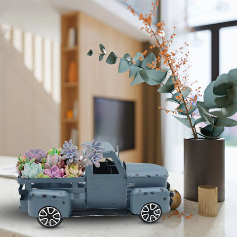 Blue Metal Pickup Truck Decor For Farmhouse Tables with succulents and flowers, showcasing vintage small car ornament style