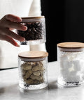 Top Shelf Airtight Glass Storage Jars 320 Milliliters with durable sealed lids holding coffee beans and snacks.