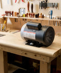 0.5 HP 1725 RPM Air Compressor Motor Single Phase 115V 230V 56 Frame with 5/8 Inch Shaft on a workbench.