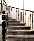 Straight Up Solid Aluminum Stair Spindles Deck Balusters Fully Adjustable Railing Kit For Your Dream Staircase 12 Pack indoor staircase with elegant black and gold railing.