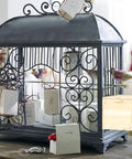 Decorative display of Paulownia Wood Nesting Box For Pet Birds Super Cozy Insulated Breeding Home with bird figurines.