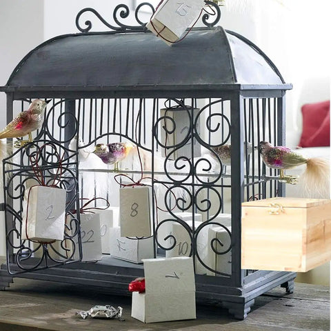 Decorative display of Paulownia Wood Nesting Box For Pet Birds Super Cozy Insulated Breeding Home with bird figurines.