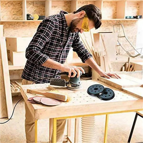 Ditch Your Old Pads And Grab 4 Premium Hook Loop Sanding Backing Discs For Orbital Sanders, used by man sanding wood.