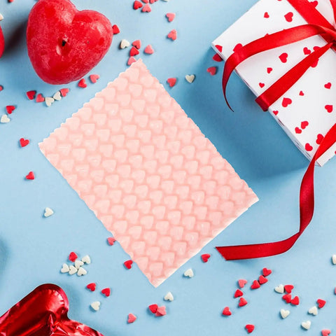 Pink Heart Shaped Bubble Mailers Pack For Jewelry And Delicate Items With Shockproof Plastic Bags on blue background