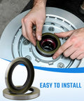 Person installing Double Lip Grease Seal Kit Heavy Duty For 5200 7000 Lb RV Trailer Axles Two And A Quarter Inch Inner Diameter