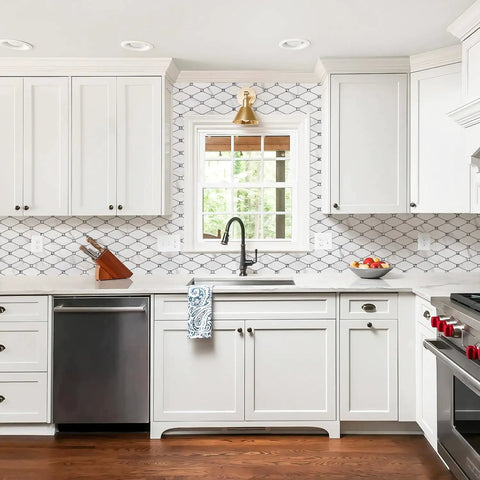 Calacatta Style Peel and Stick Backsplash Tiles 10 Sheets Self Adhesive Aluminum Composite Glass Mosaic for Kitchen Bathroom Fireplace and RV DIY Friendly Easy Install Heat Resistant Includes Gloves in modern white kitchen with wooden floor and window view.