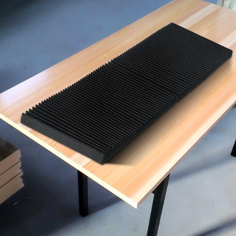 Flexible Milling Machine Bellows Cover And Way Covers For Dust Protection on wooden table, black accordion style, 130mm length
