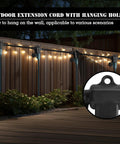 Badass 25 Foot Heavy Duty Outdoor Extension Cord Featuring Six Perfectly Spaced Power Outlets And Sleek Black Waterproof Jacket for Holiday lights hanging on a wall.