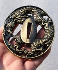 Dragon Pattern Alloy Tsuba Hand Guard For Katana Wakizashi And Tanto Dope Yellow Finish over hand, detailed view