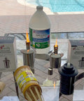 Polished Stainless Steel Table Top Tiki Torch Canister With Refillable Fuel Reservoir for outdoor use on a glass table