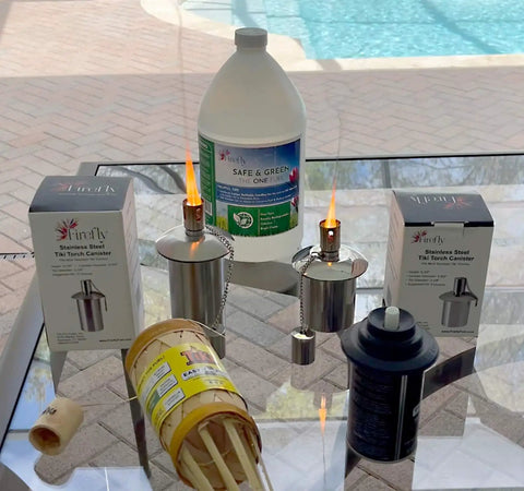 Polished Stainless Steel Table Top Tiki Torch Canister With Refillable Fuel Reservoir for outdoor use on a glass table