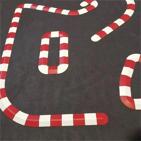 Ultimate DIY RC Track Barrier Kit 26 Piece For One Seventy Six Scale Cars Road Obstacle Set with red and white striped barriers.