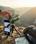 HD Monocular Telescope With 42mm Objective Lens on tripod with smartphone adapter, used for outdoor viewing in mountainous landscape