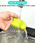 Close-up of green plastic-handle crinkle cutter with stainless steel ridged blade under running water.