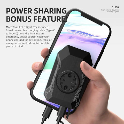 Hand holding Street Ready Front Bike Light With Garmin Mount for Day And Night Rides, shown as phone charger