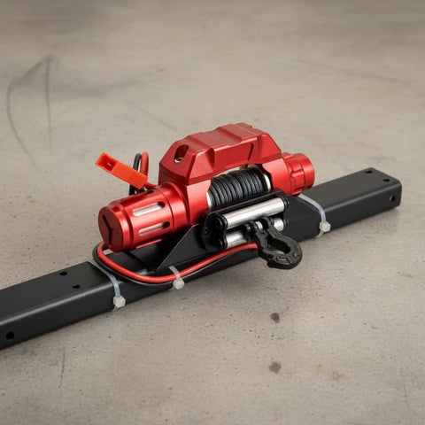 Super Cool CNC Electric Winch For RC Crawler Trucks With Metal Hook Perfect For Rock Gardens And Tricky Terrain Workshop Builds To Crush Scale Rig Challenges, red metallic design, steel cable and hook.